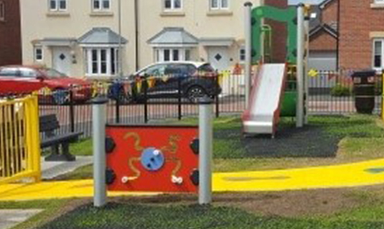 a small childrens park with a slide